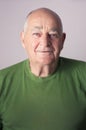 Senior man smiling in studio portrait Royalty Free Stock Photo