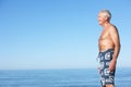 Senior Man Standing On Summer Beach Royalty Free Stock Photo