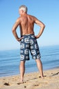 Senior Man Standing On Summer Beach Royalty Free Stock Photo