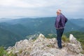 Senior man standing on top of a mountain Royalty Free Stock Photo