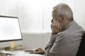 Senior man staring at the computer screen