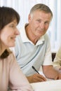 Senior man studying with other students Royalty Free Stock Photo