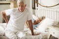 Senior Man Suffering From Backache Getting Out Of Bed Royalty Free Stock Photo