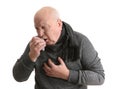 Senior man suffering from cough on white