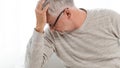 Senior man suffering from headache at home Royalty Free Stock Photo