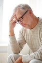 Senior man suffering from headache at home Royalty Free Stock Photo