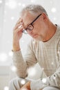 Senior man suffering from headache at home Royalty Free Stock Photo