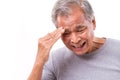 Senior man suffering from headache, stress, migraine