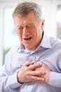 Senior Man Suffering Heart Attack At Home Royalty Free Stock Photo