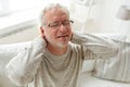 Senior man suffering from neckache at home Royalty Free Stock Photo