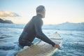 Senior man surfing in sea ocean, water waves in Australia sky and mental health retirement. Training body at beach for Royalty Free Stock Photo