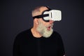 Senior man surprised using virtual reality glasses Royalty Free Stock Photo