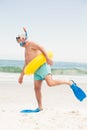 Senior man with swimming ring and flippers at the beach Royalty Free Stock Photo