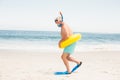 Senior man with swimming ring and flippers at the beach Royalty Free Stock Photo