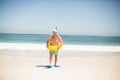 Senior man with swimming ring and flippers at the beach Royalty Free Stock Photo