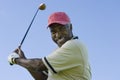 Senior Man Swinging A Golf Club Royalty Free Stock Photo