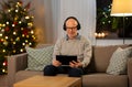 senior man with tablet pc and headphones at home Royalty Free Stock Photo