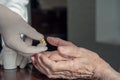 Senior man taking medication with water caring wife helping Royalty Free Stock Photo