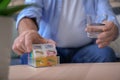 Senior man taking medicine at home, closeup Royalty Free Stock Photo