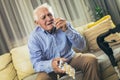 Senior man taking pills at home Royalty Free Stock Photo