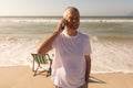 Senior man talking on mobile phone at beach Royalty Free Stock Photo