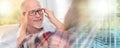 Senior man testing new eyeglasses, light effect; multiple exposure Royalty Free Stock Photo