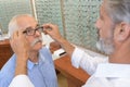 Senior man trying new eyeglasses Royalty Free Stock Photo