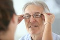 Senior man trying on new eyeglasses Royalty Free Stock Photo