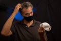 Man trying to decided what protective mask to wear