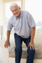Senior Man Trying To Sit Down Royalty Free Stock Photo