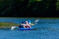 Senior man and two women kayaking on A Dnieper river