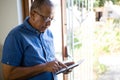 Senior man using digital tablet at nursing home Royalty Free Stock Photo