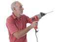 Senior man using an electric drill