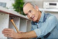 Senior man using hammer Royalty Free Stock Photo