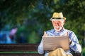 Senior man using laptop computer at rest in the park outdoors Royalty Free Stock Photo