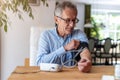 Senior man using medical device to measure blood pressure Royalty Free Stock Photo