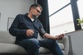 Senior man using medical device to measure blood pressure Royalty Free Stock Photo