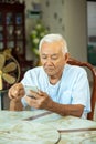 Senior man using the mobile phone at home Royalty Free Stock Photo