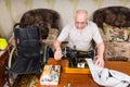 Senior Man Using Old Fashioned Sewing Machine Royalty Free Stock Photo