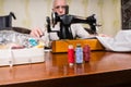 Senior Man Using Old Fashioned Sewing Machine Royalty Free Stock Photo