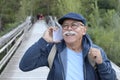 Senior man using phone in the park Royalty Free Stock Photo