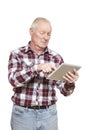 Senior man using tablet computer looking confused Royalty Free Stock Photo