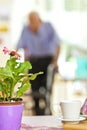 Senior man using a walker in a retirement home Royalty Free Stock Photo