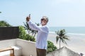 Senior man on vacation taking a selfie Royalty Free Stock Photo