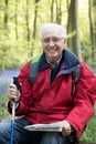 Portrait Of Senior Man On Walk Through Bluebell Wood