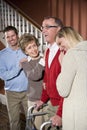 Senior man with walker at home with family Royalty Free Stock Photo