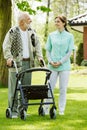 Senior man with walker in the park of modern nursing home Royalty Free Stock Photo