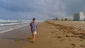 Senior man walking on beach