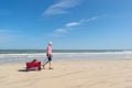 Senior man walking with dog at beach Royalty Free Stock Photo