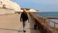 Man walking under Telscombe Cliffs in Sussex 